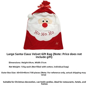 Macro view of velvet Santa gift bag with red polka dot ribbon and Ho Ho Ho embroidery