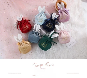 Close-up of velvet rabbit ear candy bags with Sweet Moment gold foil stamping