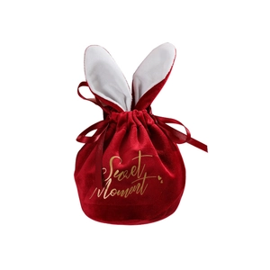 Red velvet rabbit ear favor bag with gold Sweet Moment text for weddings and gifts
