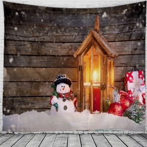 Detail of Christmas wall tapestry featuring snowman and lanterns on wooden fence background