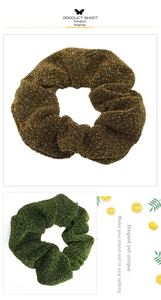 Detail of gold and green metallic scrunchies with shimmering tinsel fabric texture