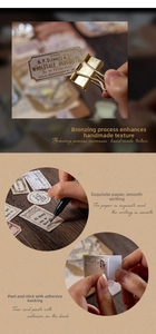 Macro view of vintage gold foiled stickers showing textured paper and adhesive back