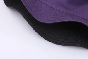 Detail shot of the precise stitching and durable cotton canvas fabric of the bucket hat