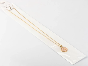 Detail view of 18k gold plated stainless steel necklace with pink shell letter A pendant