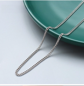 Macro shot of 2.2mm steel-tone curb chain necklace with high-polished link structure
