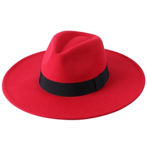 Detailed view of the red wool felt fedora hat featuring a stylish wide 9cm black ribbon band