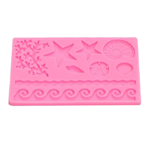 Pink silicone fondant mold featuring sea coral and starfish designs for DIY cake decorating