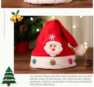 Detailed view of plush red Christmas hat with Santa applique and glittery snowflakes