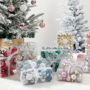 Christmas ball and star ornament gift sets in various colors displayed on a festive tree