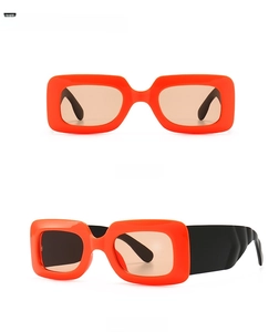Detailed front and side view of orange rectangular sunglasses with thick black arms
