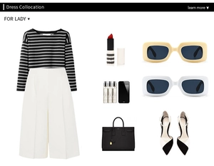 Flat lay of women's vintage sunglasses paired with a monochrome knit and fashion accessories