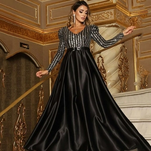 Detail of the plunging V-neckline and silver sequin stripes on this elegant black evening gown