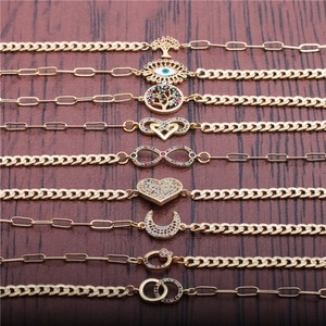 Punk hip hop gold bracelets with colorful zircon charms and heart pendants on wood