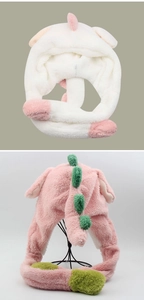 Detailed view of plush dinosaur earflap hat with soft fuzzy texture and cute 3D spine accents