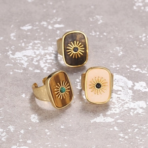 Adjustable gold flower rings with natural Tiger Eye and Lapis Lazuli stone insets