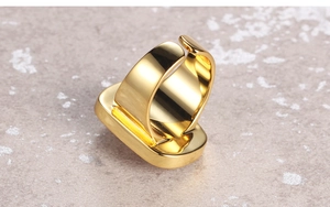 Detailed close-up of polished gold adjustable ring band showing smooth texture and finish