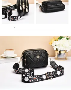 Macro detail of black quilted leather crossbody bag with three zipper compartments