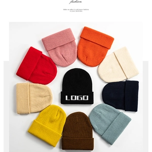 Detailed grid of rib-knit beanies in ten vibrant colors with a folded cuff design