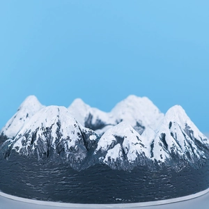 Macro shot of snow mountain silicone mold with realistic black rock and white snow texture