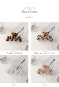 Four patterns of acetate hair claws including tortoiseshell and checkerboard designs