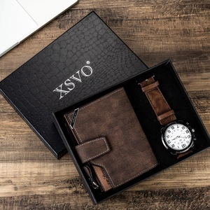 Detail of men's gift set featuring brown suede watch and wallet in black crocodile box
