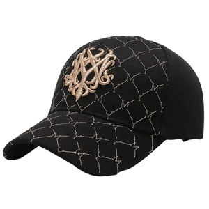 Classic black baseball cap with golden embroidery and diamond-stitched brim detail