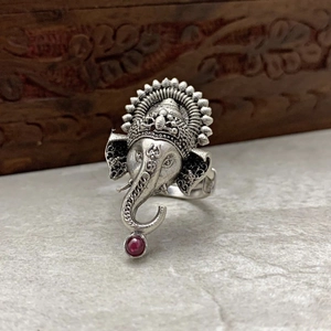 Vintage silver Ganesha elephant ring with a round red gemstone in retro ethnic style