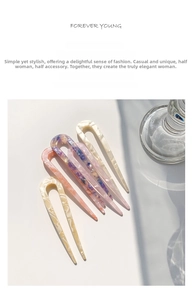 Detail of U-shaped acetate hairpins with marble texture in four pastel colors
