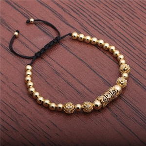 Adjustable woven bracelet featuring golden beads and micro-pave black zircon accents
