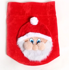 Close-up of premium red velvet Christmas gift bag featuring a 3D Santa Claus plush design