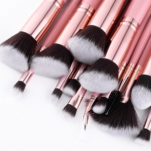 Detail of 16-piece makeup brush set with rose gold ferrules and soft gradient bristles