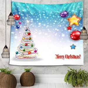 Detail of Christmas wall tapestry featuring a spiral tree and stars on a gray wall