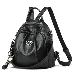 Fashionable black PU leather backpack for women with heart buckle and cow charm