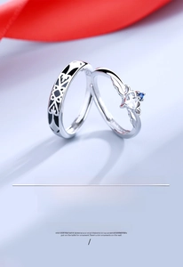 Detailed macro view of S925 silver couple rings featuring crown and knight motifs