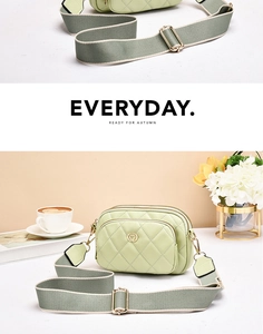 Detail of avocado green quilted crossbody bag with stylish wide woven strap and gold zipper
