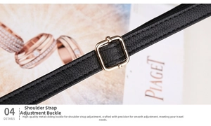 Detail of black litchi grain leather shoulder strap with adjustable gold buckle
