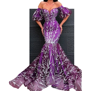 Detail of purple off-shoulder evening gown with silver thorn patterns and puff sleeves