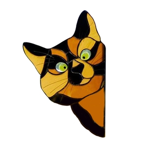 Detailed close-up of a cat door frame topper with faux stained glass patterns