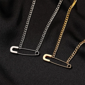 Minimalist safety pin necklaces in gold and silver finish with classic curb chains