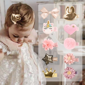 10-piece pink and gold girls' hair clip set with glitter crown, stars and bunny ears