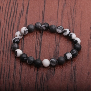 8mm tiger eye and zebra stone beaded bracelet for men on a dark textured background