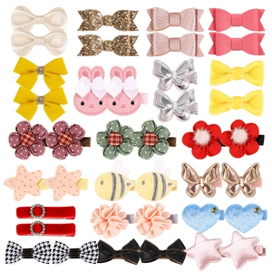 Colorful floral and bow hair clip set for girls featuring sequins and faux leather
