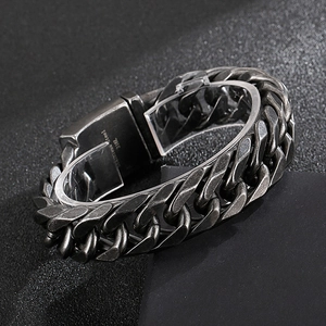 Detail shot of stainless steel 316L curb chain bracelet with visible material hallmarks