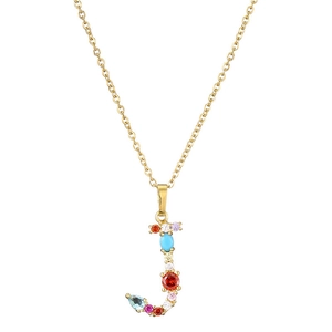 Close-up of J-shaped gold necklace pendant set with colorful mixed gemstones