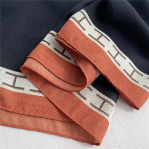 Fashionable color-block cotton linen scarf with black and orange panels and H-pattern border