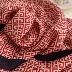 Close-up of red and white interlocking pattern on black soft cotton feel scarf shawl
