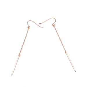 Detail showing elegant rose gold long chain drop earrings with polished minimalist finish