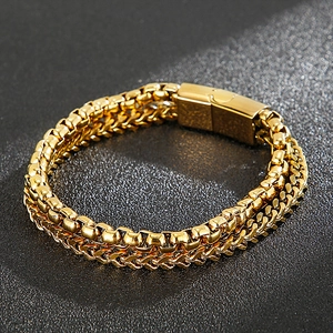 Detail of gold double-layered square and wheat link bracelet with magnetic clasp