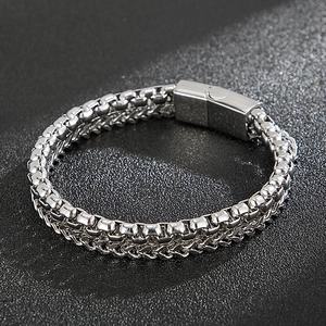 Detail of silver stainless steel double-layer woven chain bracelet with magnetic clasp
