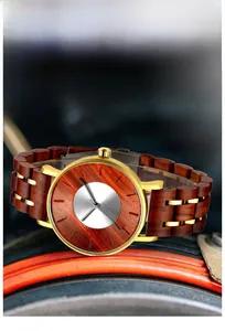 Detailed close-up of wood grain and golden metal links on a men's quartz watch